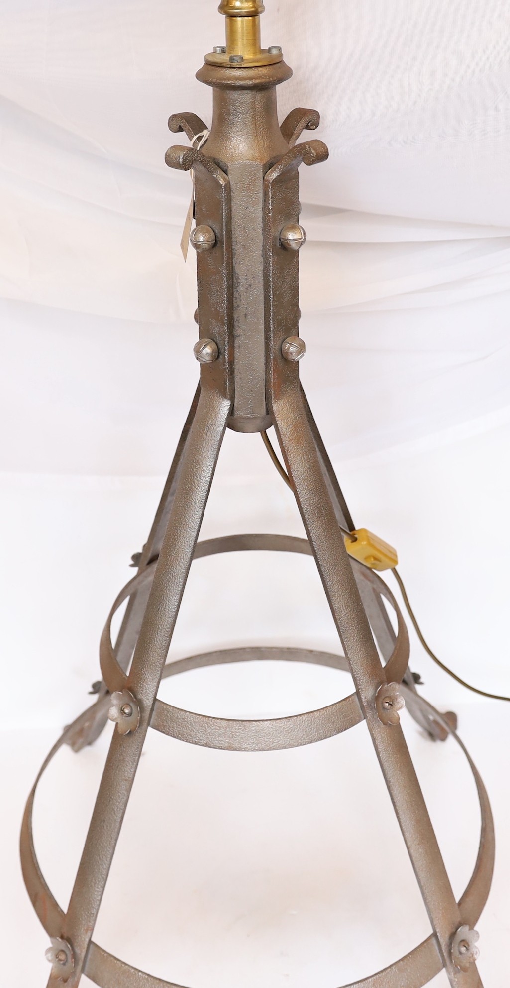 A pair of industrial style brass and wrought iron adjustable lamp standards, height 194cm. width of base 62cm